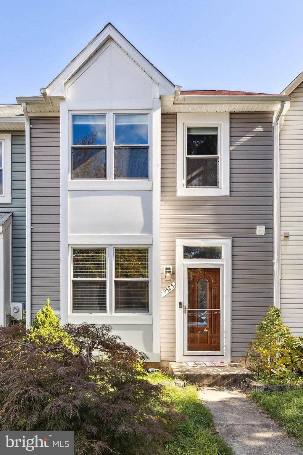 9525 Clocktower Lane Columbia, MD 21046 - Photo 1 of 19 a view of a house with a yard