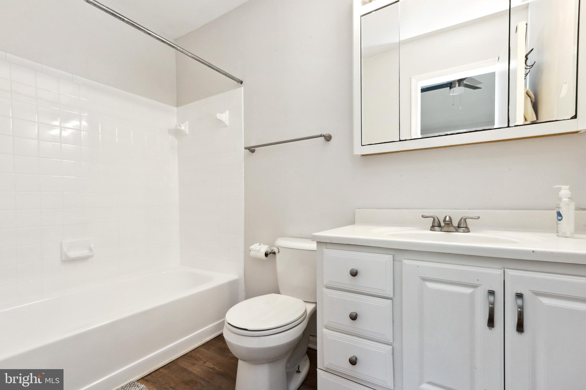 9525 Clocktower Lane Columbia, MD 21046 - Photo 11 of 19 a bathroom with a sink a toilet and shower