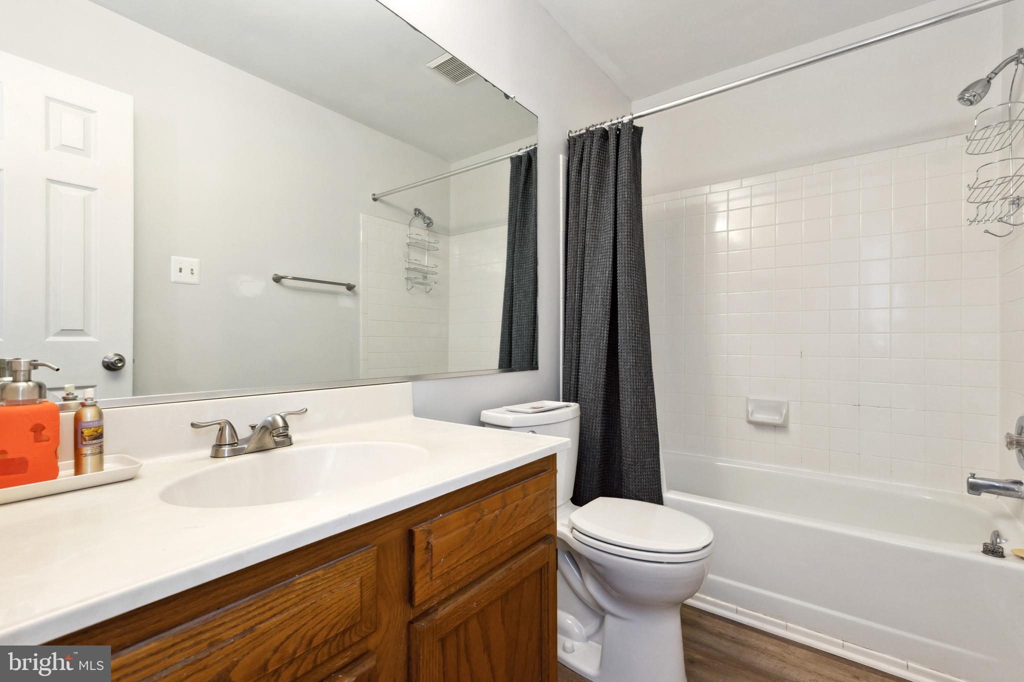 9525 Clocktower Lane Columbia, MD 21046 - Photo 13 of 19 a bathroom with a sink a toilet and a mirror