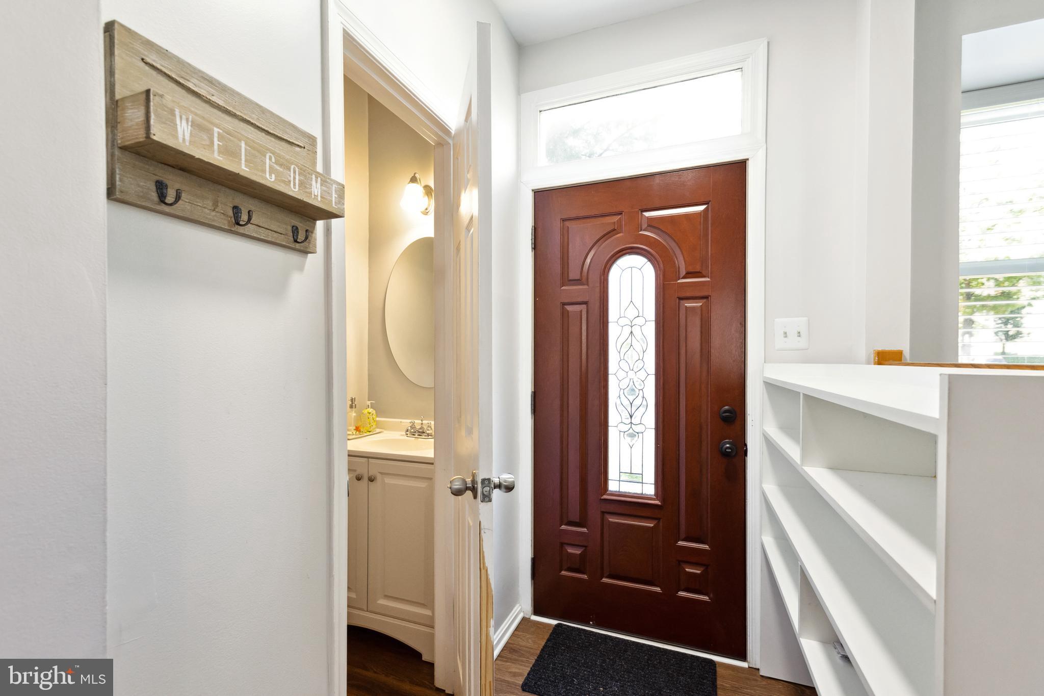 9525 Clocktower Lane Columbia, MD 21046 - Photo 2 of 19 a view of a bathroom with a bathtub and a mirror