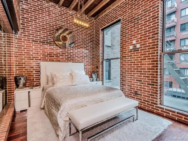 a bedroom with a bed and a shower