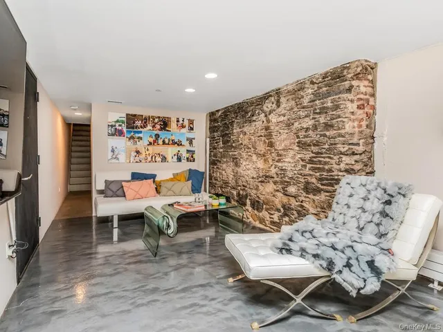a living room with furniture and a rug