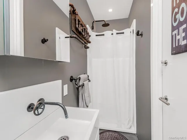 a bathroom with a tub and a shower