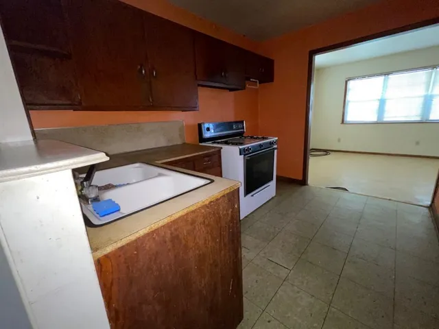 a kitchen with a stove and a microwave