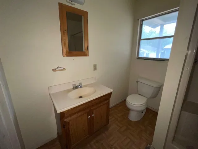 a bathroom with a sink and a toilet