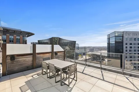 a view of a terrace with furniture and stove