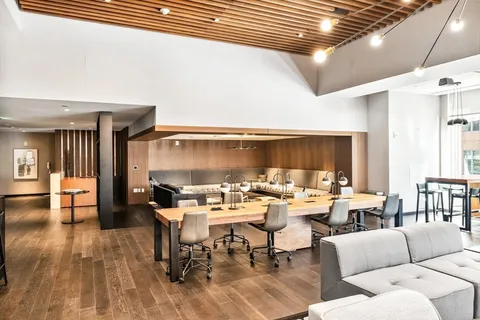 a kitchen with a table chairs and a stove