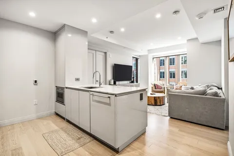 a view of living room with furniture and flat screen tv