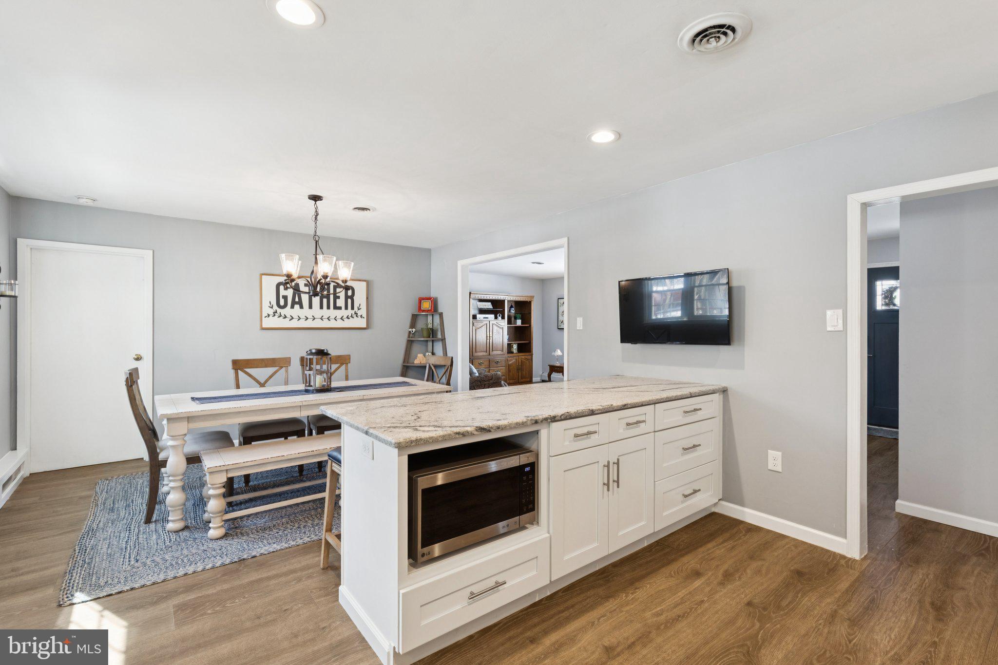 404 Enfield Road Oreland, PA 19075 - Photo 4 of 43 a kitchen with a stove and a microwave