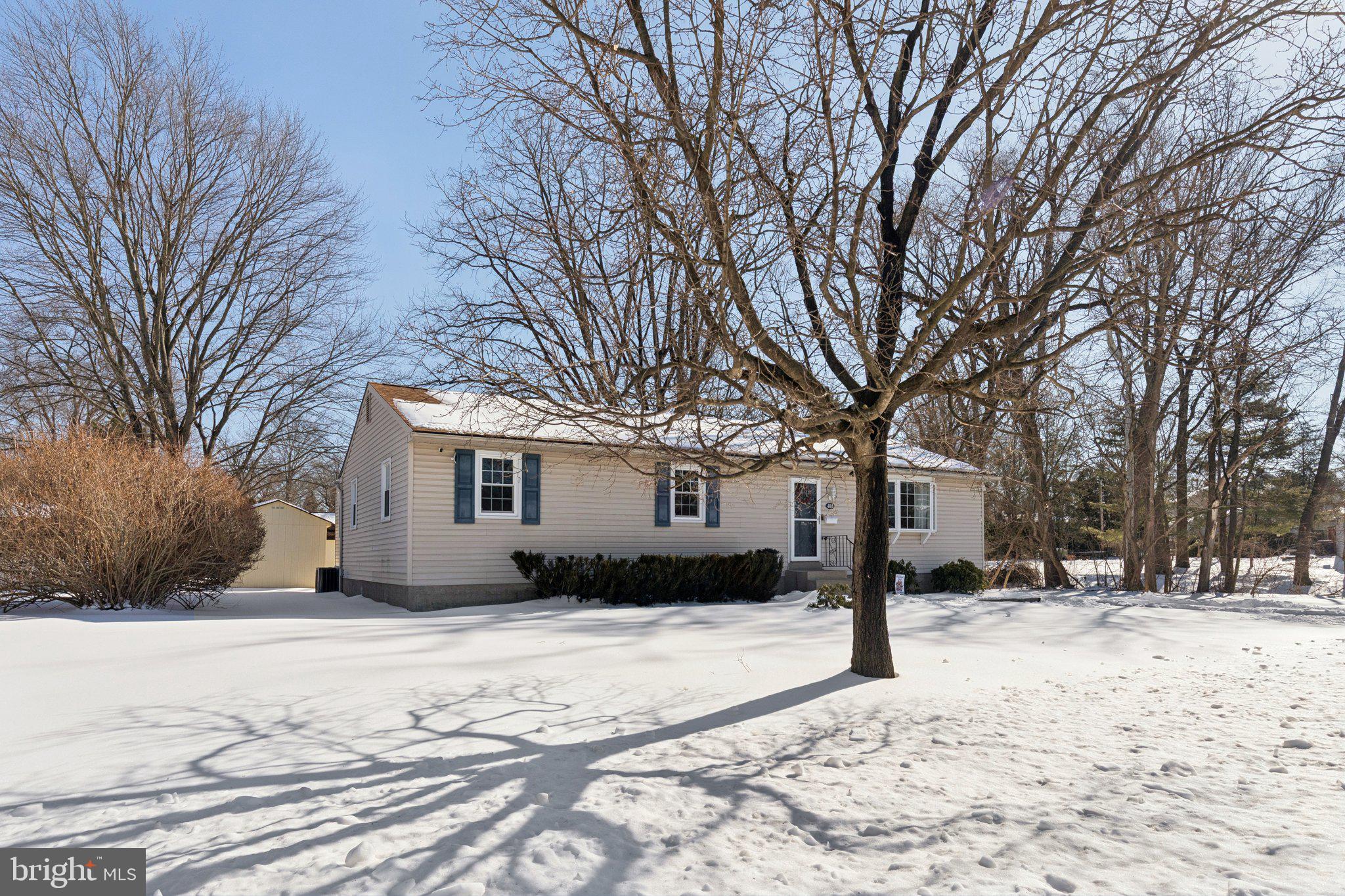 404 Enfield Road Oreland, PA 19075 - Photo 43 of 43 a street view covered with snow