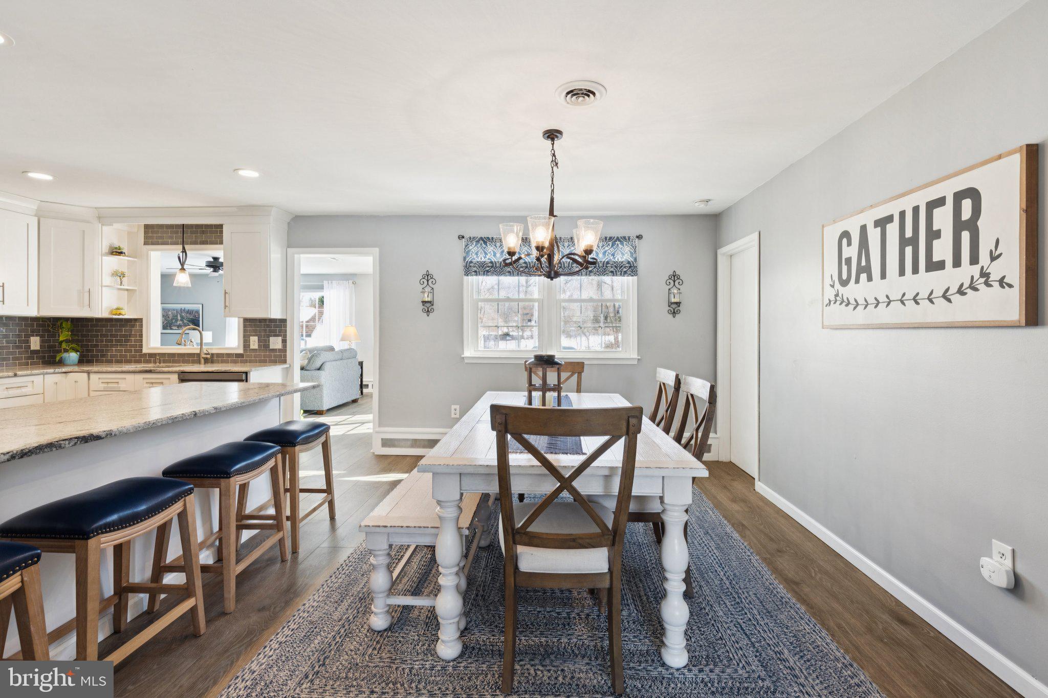 404 Enfield Road Oreland, PA 19075 - Photo 5 of 43 a view of a dining room with furniture and wooden floor