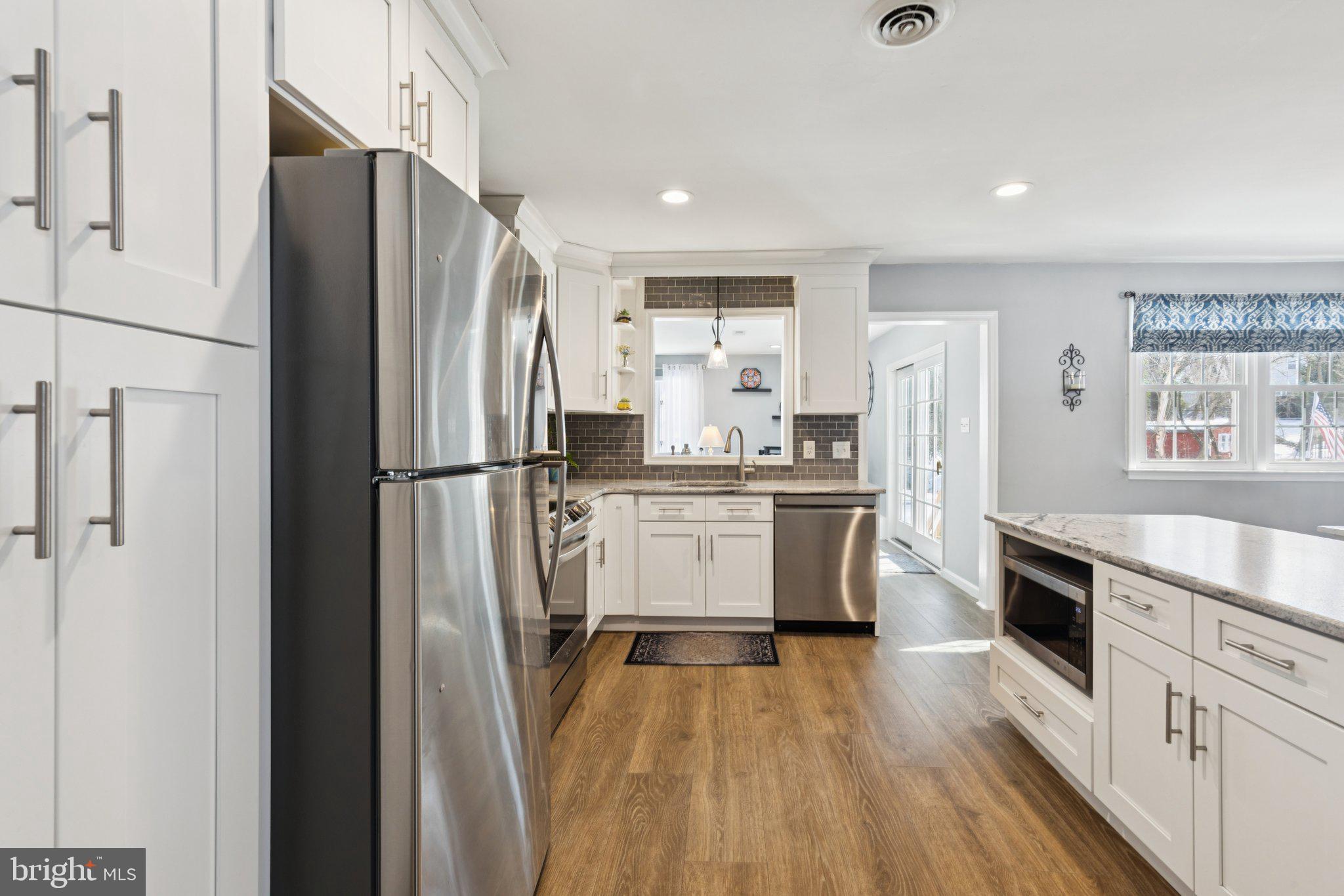 404 Enfield Road Oreland, PA 19075 - Photo 9 of 43 a kitchen with a refrigerator a sink and dishwasher