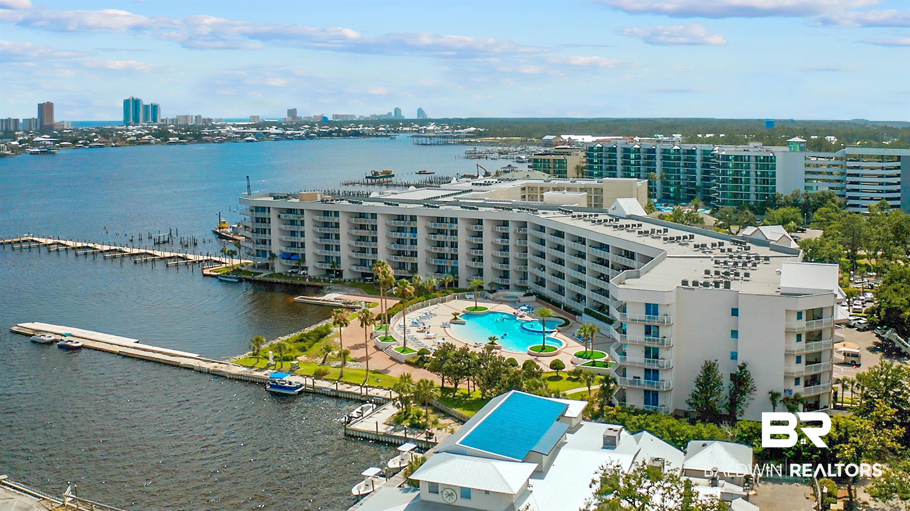 27800 Canal Road, Unit 113 Orange Beach, AL 36561 - Photo 30 of 35 View of urban area featuring a pool and a nearby body of water
