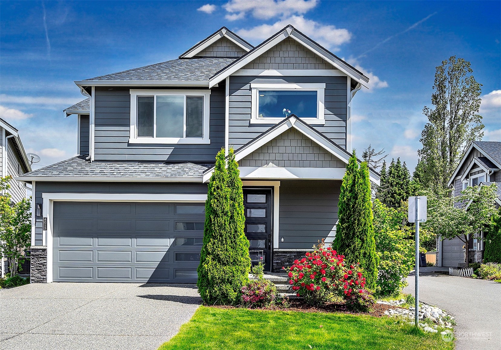 a front view of a house with a yard