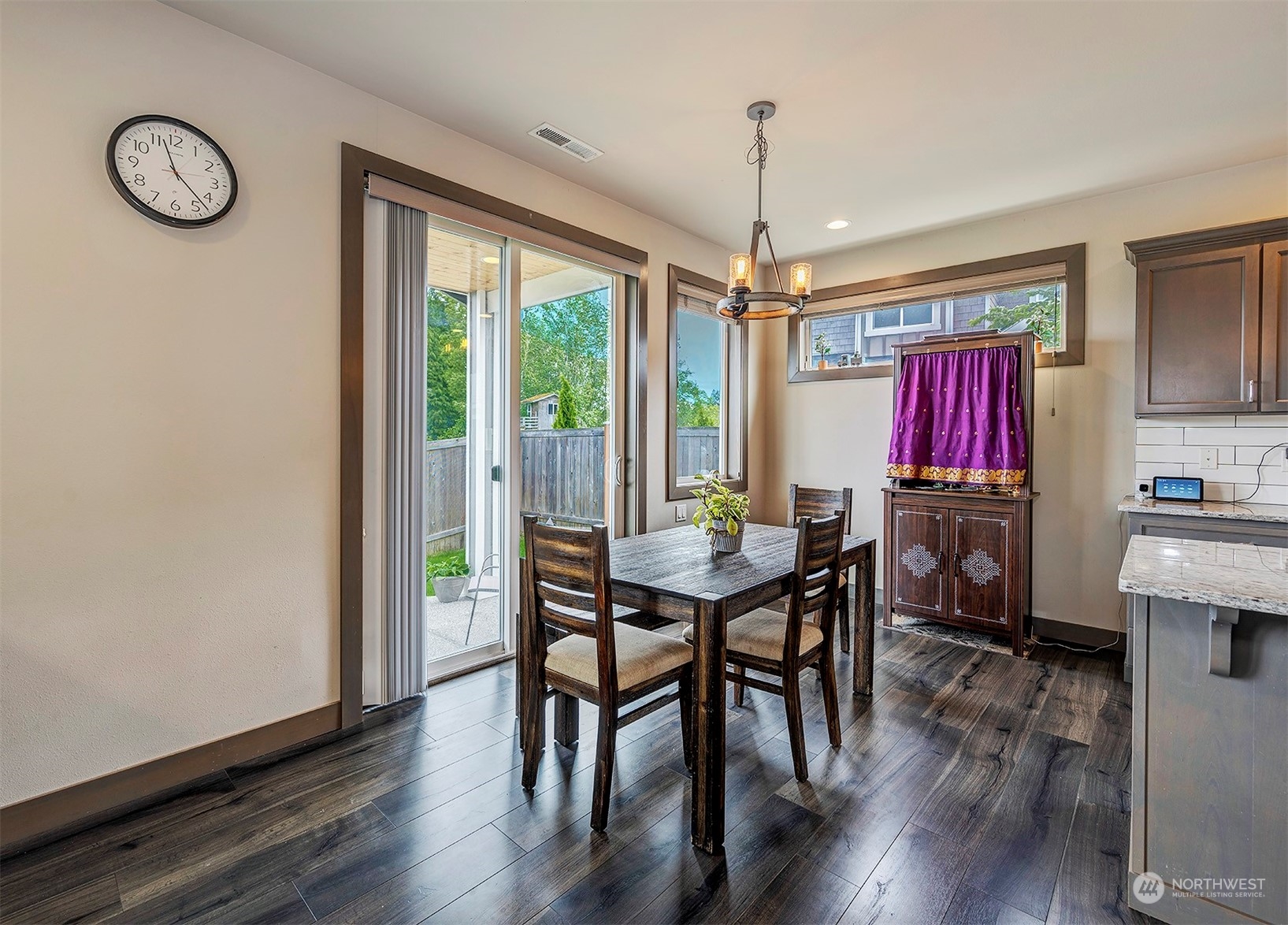 4015 147th Place Southeast Bothell, WA 98012 - Photo 11 of 31 a view of a dining room with furniture window and wooden floor