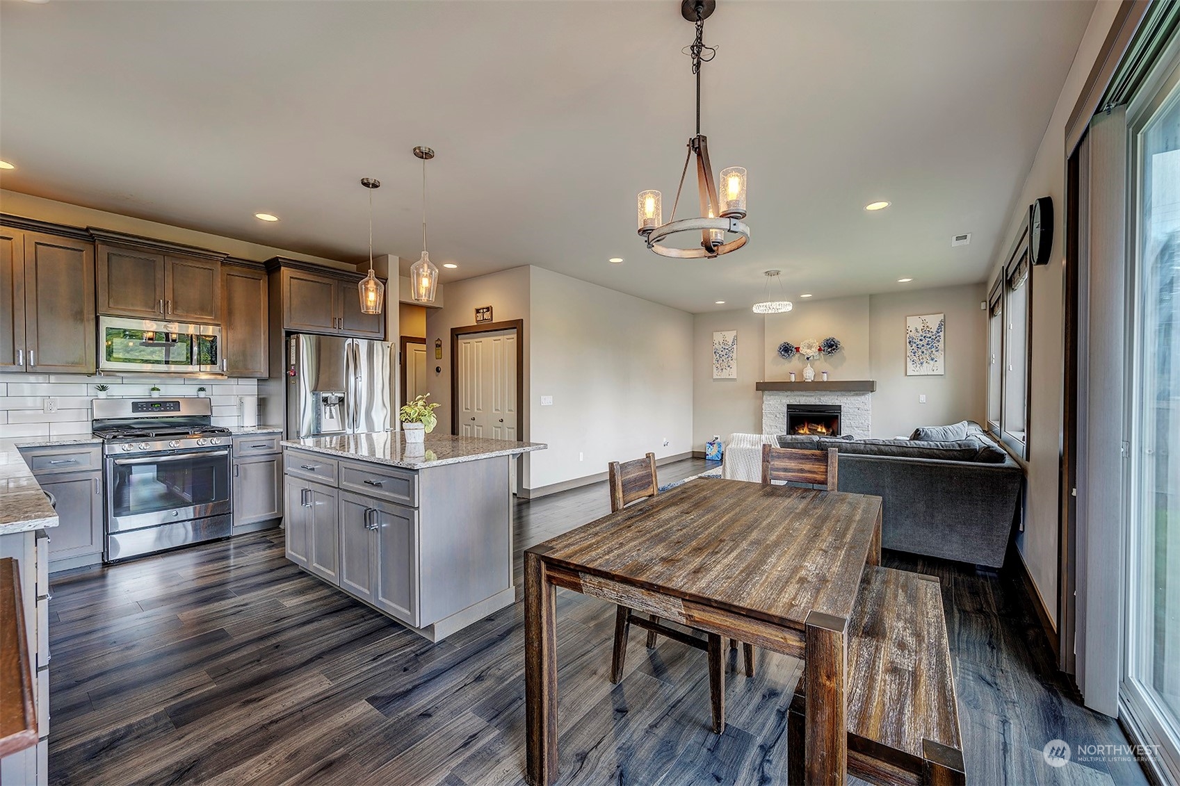 4015 147th Place Southeast Bothell, WA 98012 - Photo 12 of 31 a kitchen with stainless steel appliances granite countertop a stove refrigerator and cabinets