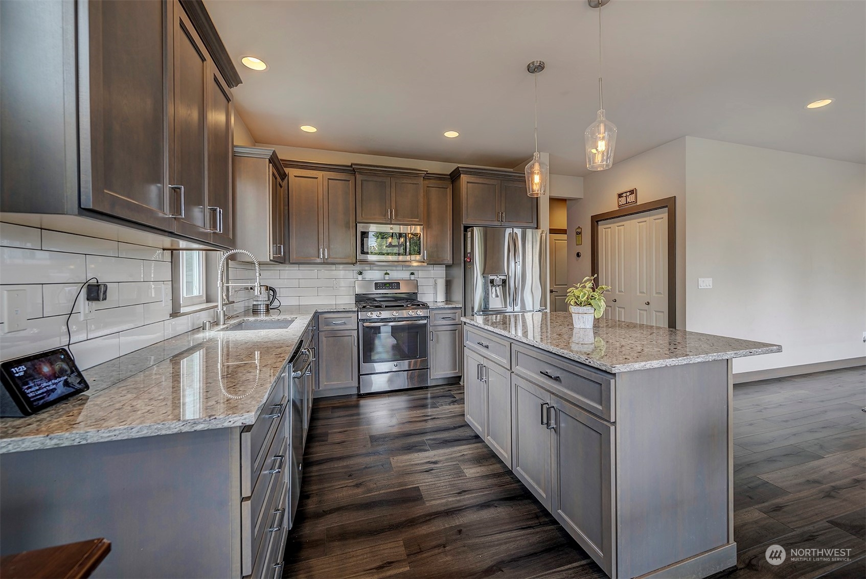 4015 147th Place Southeast Bothell, WA 98012 - Photo 14 of 31 a kitchen with stainless steel appliances a sink stove and refrigerator