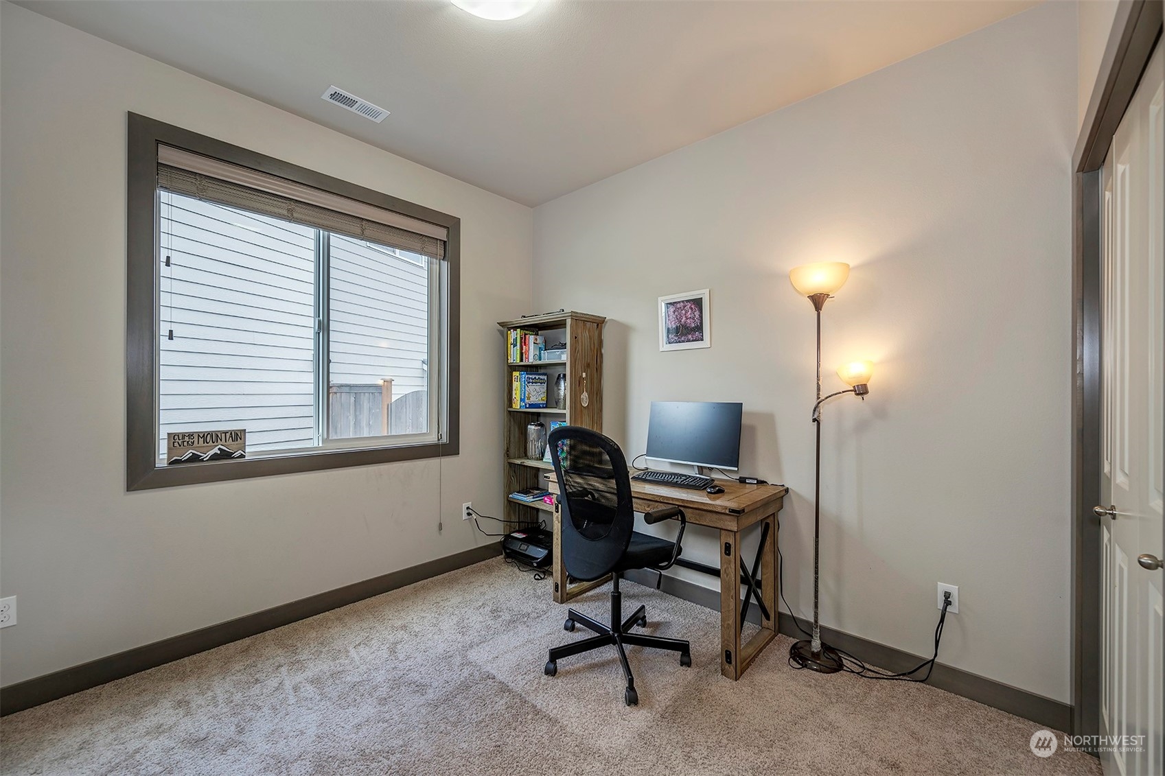 4015 147th Place Southeast Bothell, WA 98012 - Photo 16 of 31 a view of a workspace with furniture and a window