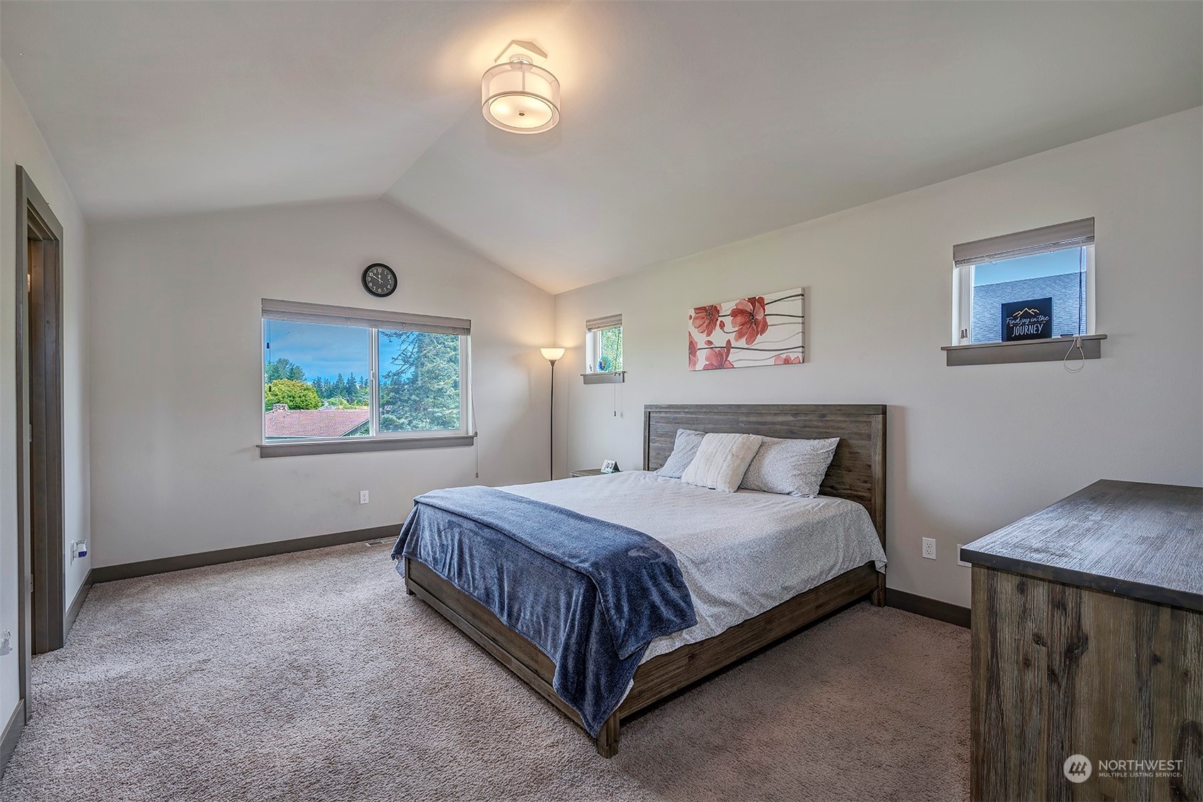 4015 147th Place Southeast Bothell, WA 98012 - Photo 18 of 31 a bedroom with a bed and a painting on the wall