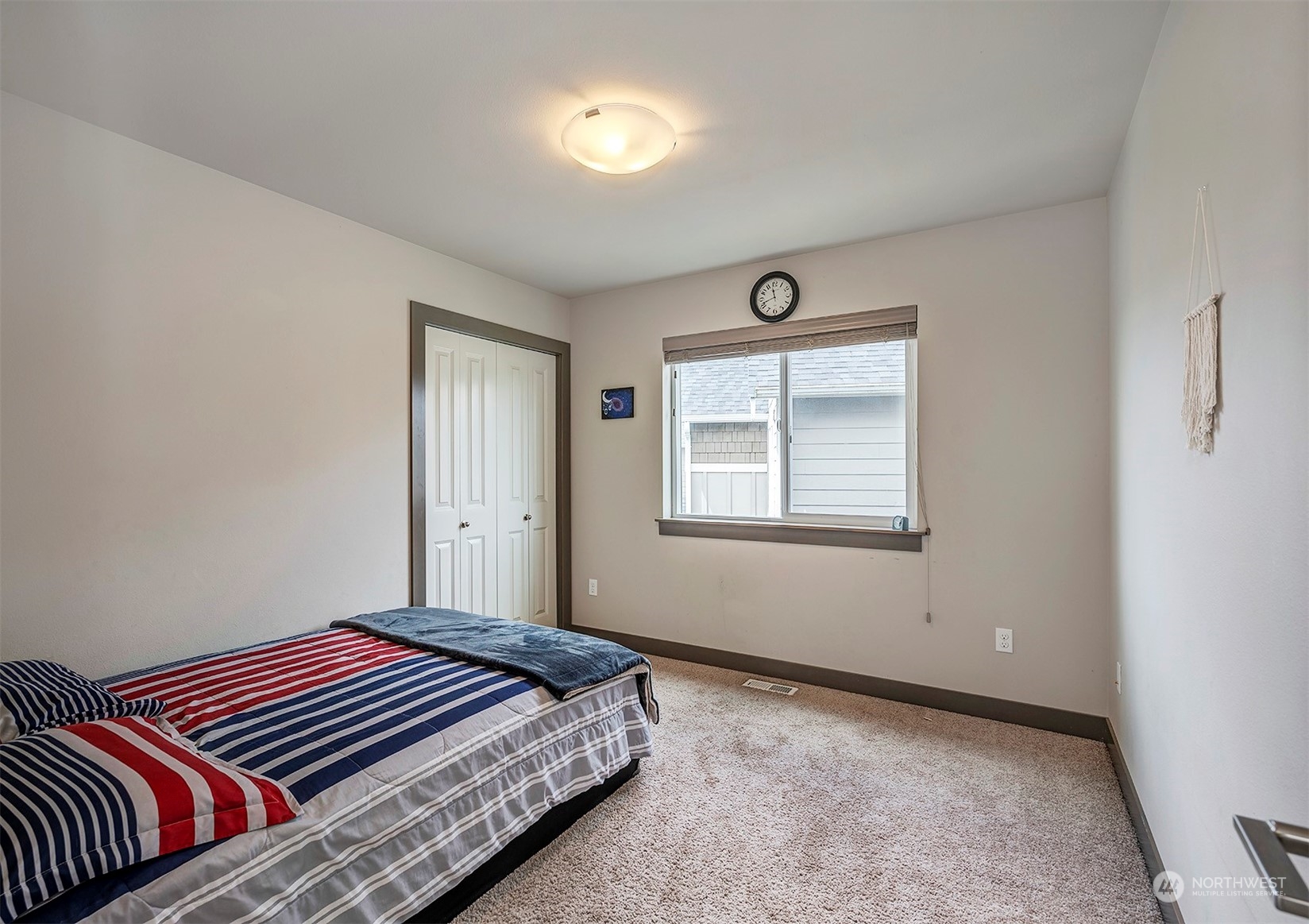 4015 147th Place Southeast Bothell, WA 98012 - Photo 22 of 31 a bedroom with a bed and a window