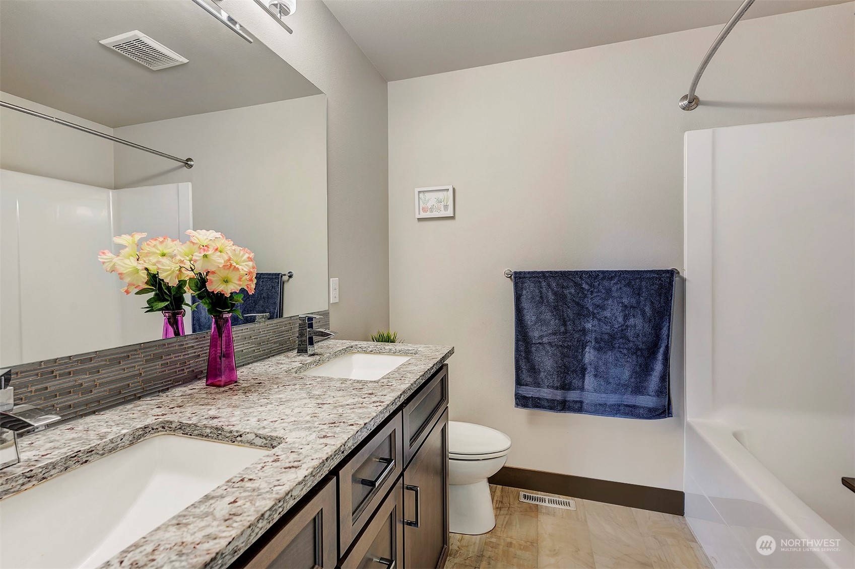 4015 147th Place Southeast Bothell, WA 98012 - Photo 24 of 31 a bathroom with a granite countertop sink a toilet and bathtub