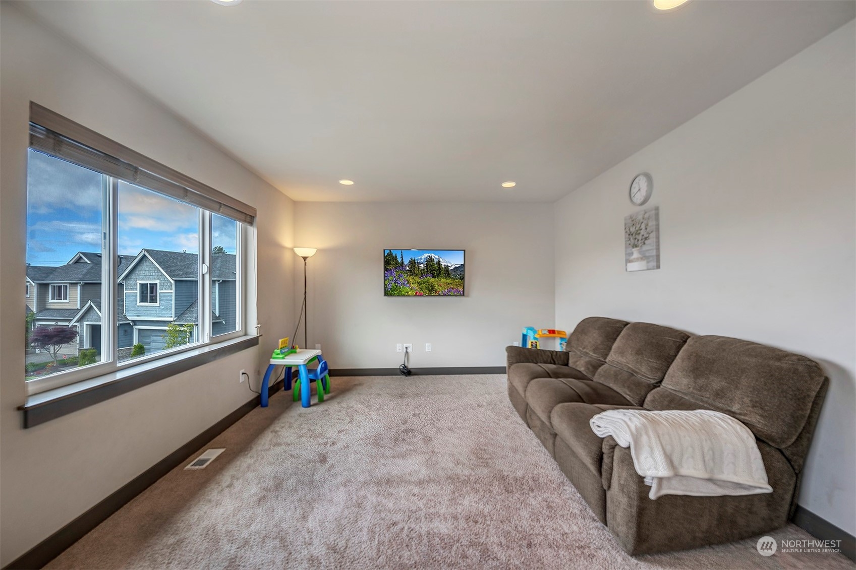 4015 147th Place Southeast Bothell, WA 98012 - Photo 25 of 31 a living room with furniture and a window