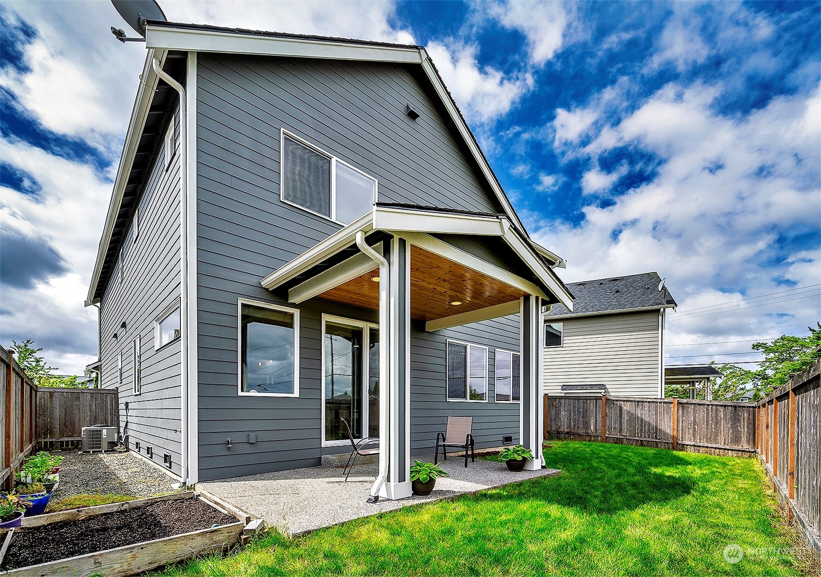 4015 147th Place Southeast Bothell, WA 98012 - Photo 27 of 31 a front view of a house with garden