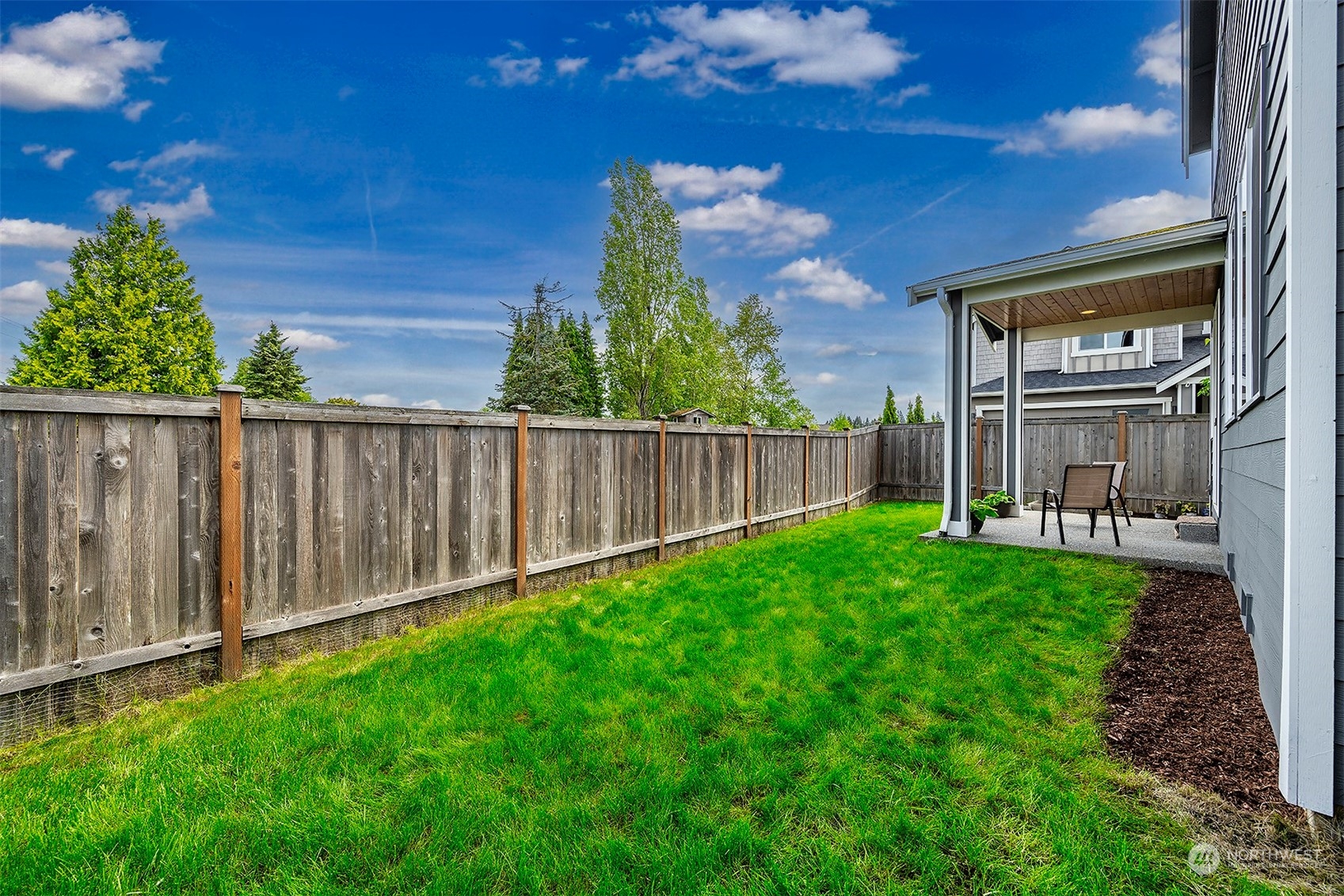 4015 147th Place Southeast Bothell, WA 98012 - Photo 28 of 31 a view of a backyard with wooden fence