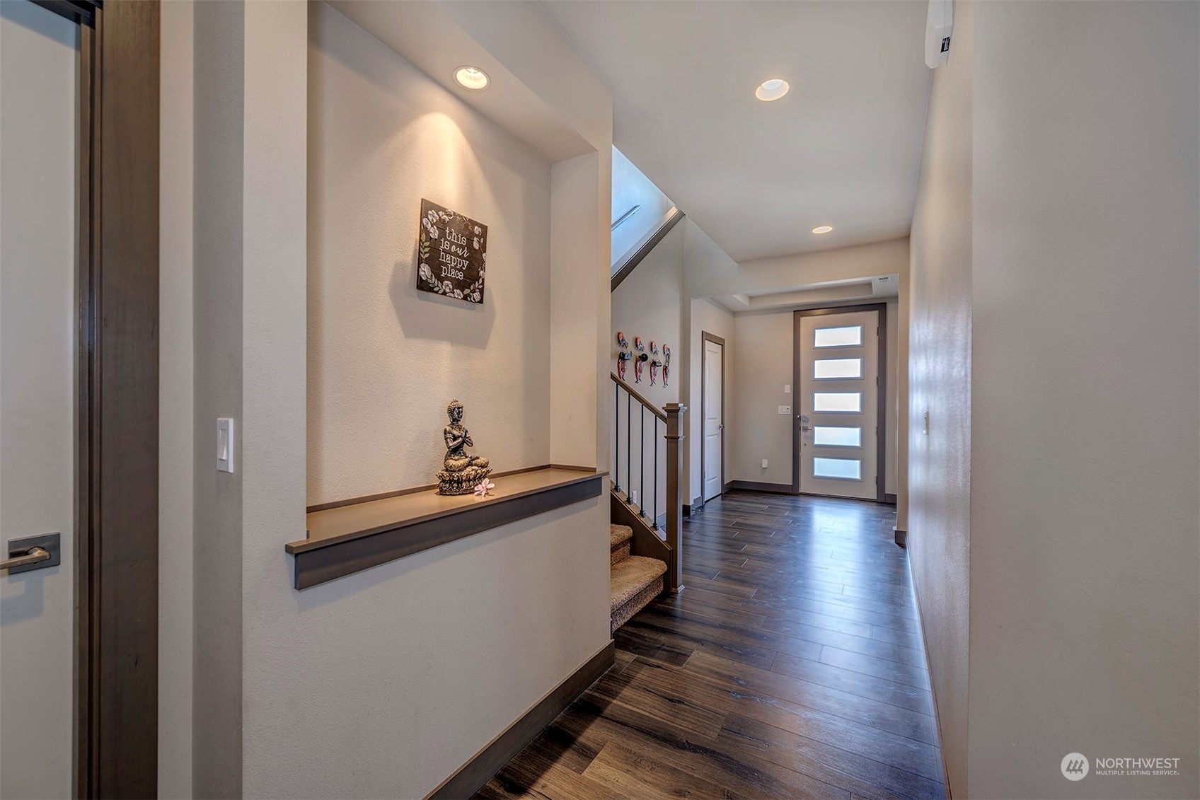 4015 147th Place Southeast Bothell, WA 98012 - Photo 6 of 31 a view of a hallway with wooden floor and stairs