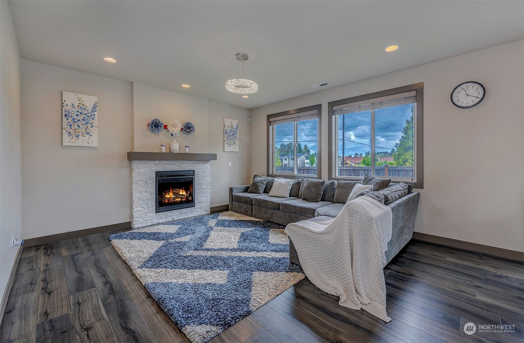 4015 147th Place Southeast Bothell, WA 98012 - Photo 7 of 31 a living room with furniture and a fireplace