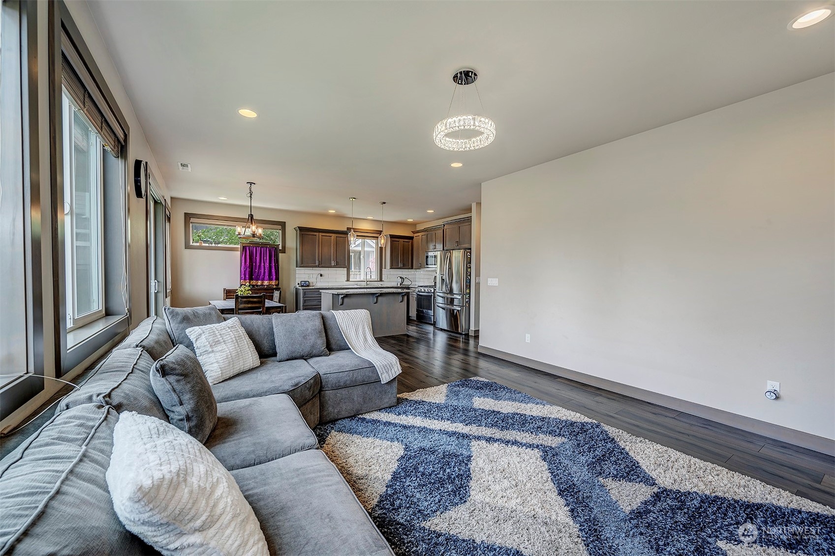 4015 147th Place Southeast Bothell, WA 98012 - Photo 8 of 31 a living room with furniture and a rug