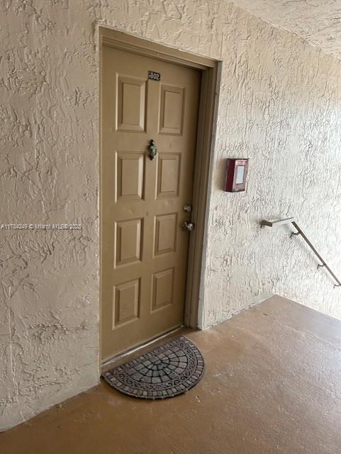 a view of a door and a bathroom