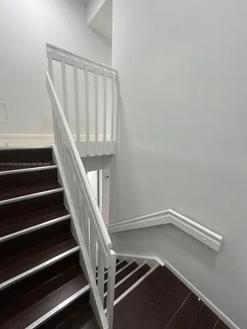 a kitchen with granite countertop a sink and a stove top oven