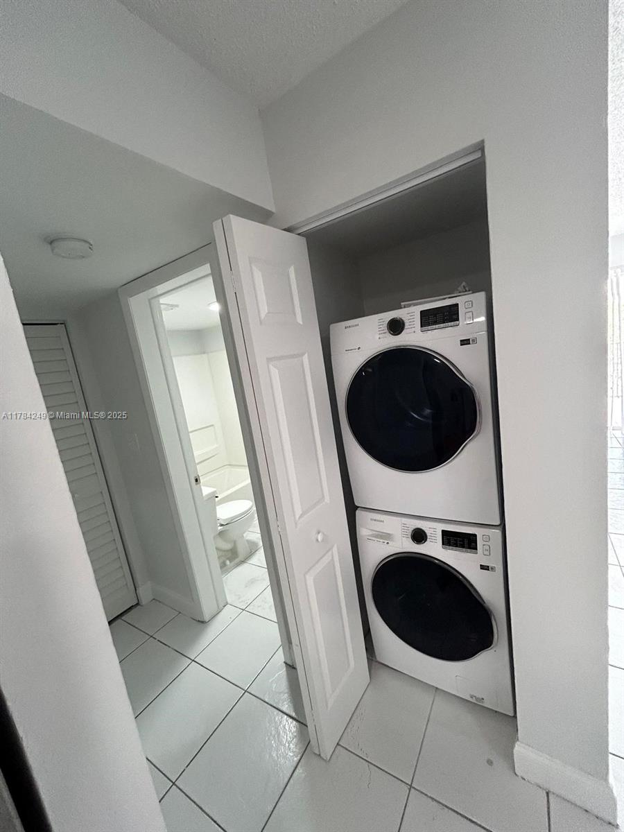 15201 Southwest 80th Street, Unit 302 Miami, FL 33193 - Photo 19 of 30 a utility room with dryer and washer