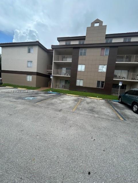 15201 Southwest 80th Street, Unit 302 Miami, FL 33193 - Photo 3 of 30 a view of a car garage