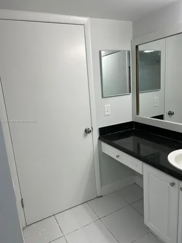 a view of an empty room and a window