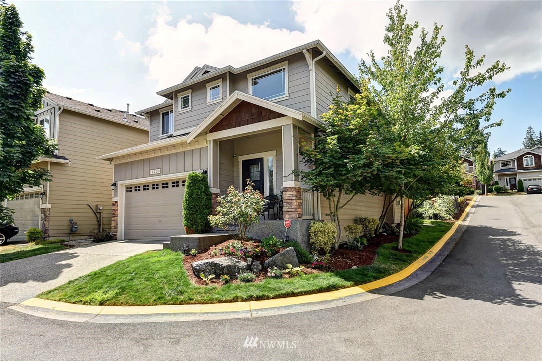 16220 2nd Avenue Southeast Bothell, WA 98012 - Photo 3 of 40 a front view of a house with a yard and potted plants
