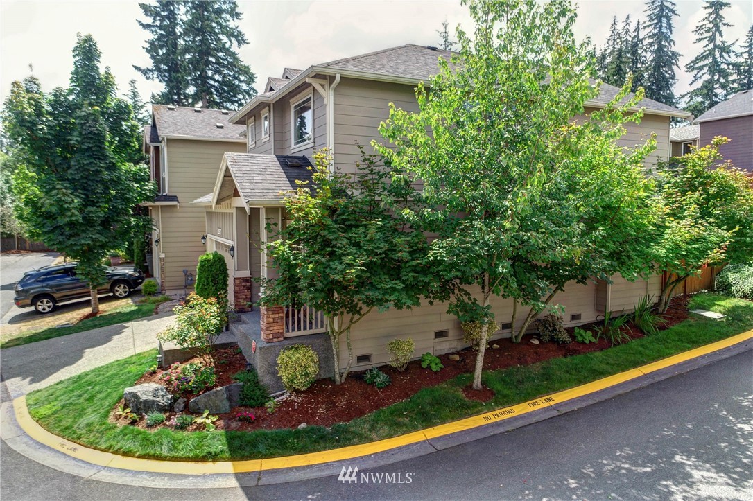 16220 2nd Avenue Southeast Bothell, WA 98012 - Photo 4 of 40 a view of a house with a small yard plants and large tree