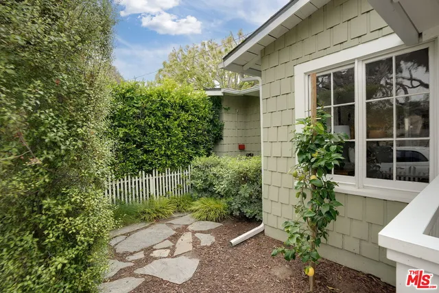 a view of a house with a garden