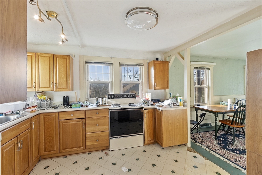 2 Kosta Avenue Rutland, MA 01543 - Photo 11 of 34 a kitchen with a sink a stove a refrigerator and cabinets