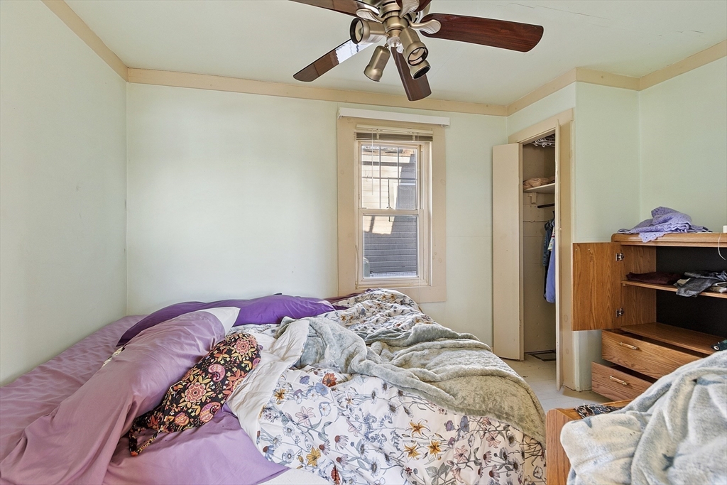 2 Kosta Avenue Rutland, MA 01543 - Photo 13 of 34 a bedroom with a bed and a chandelier