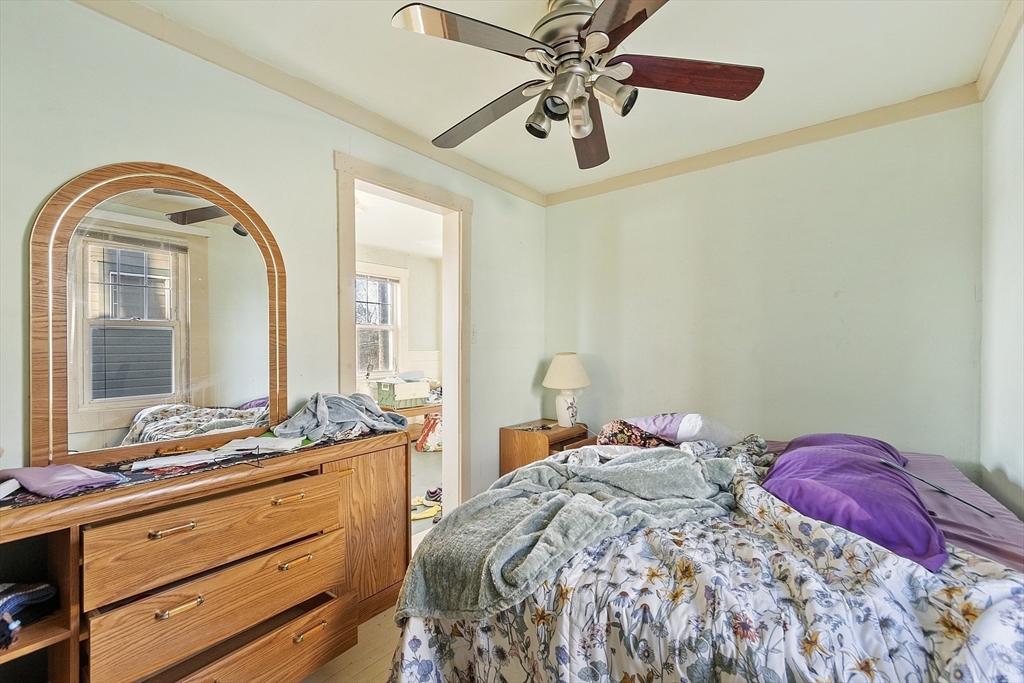 2 Kosta Avenue Rutland, MA 01543 - Photo 14 of 34 a bedroom with a bed and a chandelier