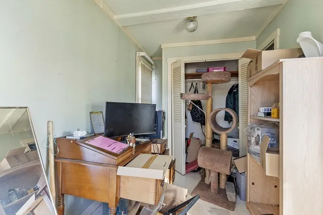 a view of a workspace with furniture and a gate