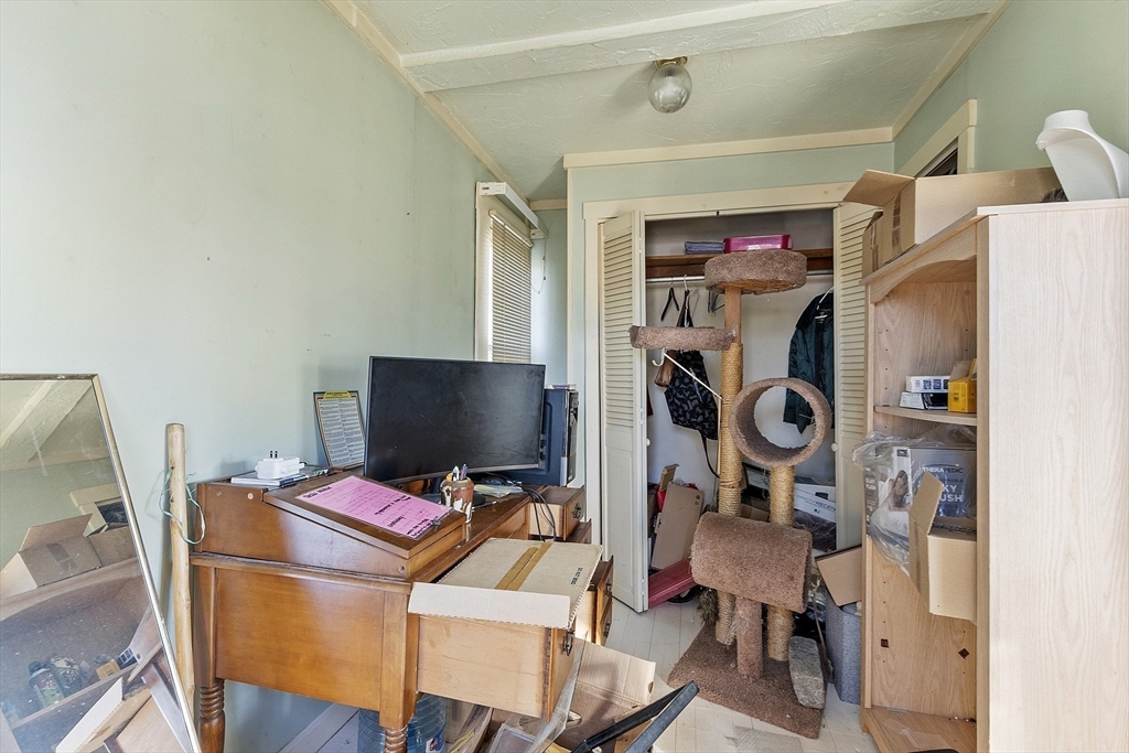 2 Kosta Avenue Rutland, MA 01543 - Photo 16 of 34 a view of a workspace with furniture and a gate