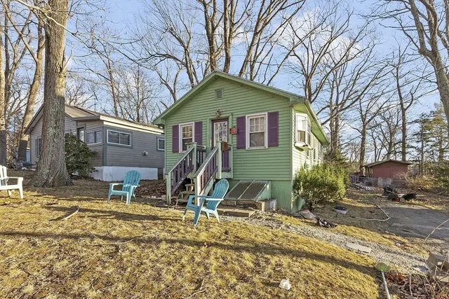 a view of a house with yard and snow