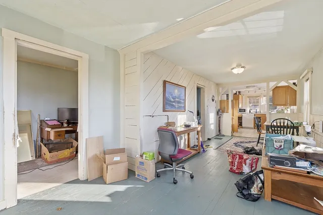 a living room with lots of furniture and gym equipment