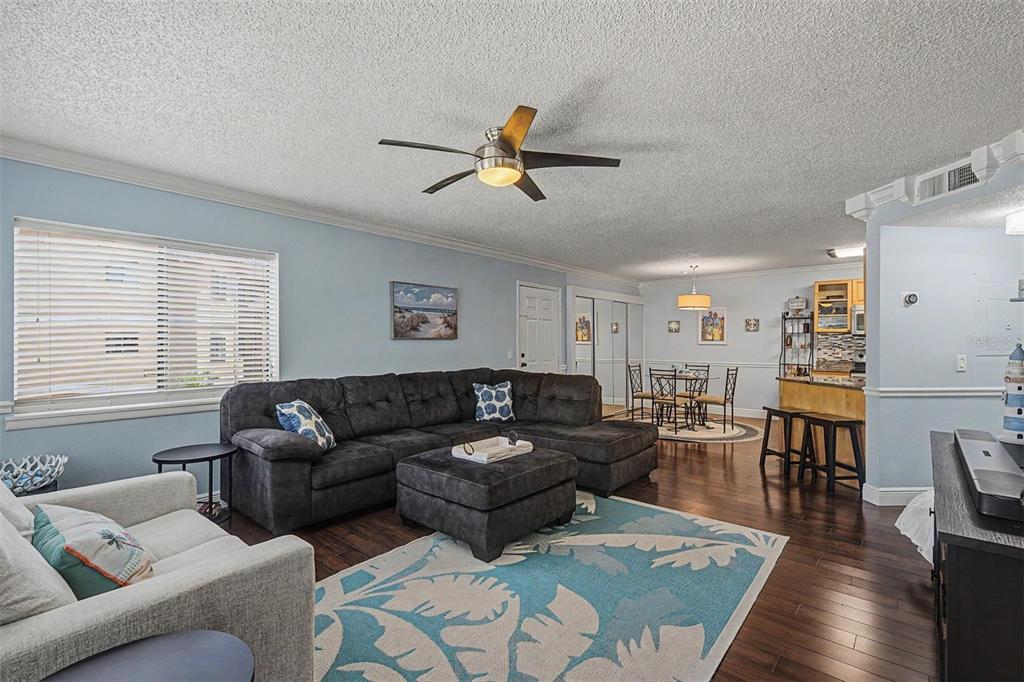 1550 South Belcher Road, Unit 525 Clearwater, FL 33764 - Photo 5 of 28 a living room with furniture kitchen view and a window
