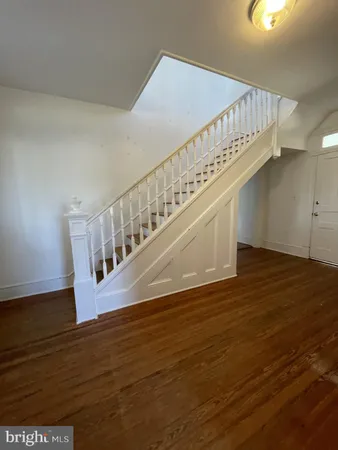 a view of entryway with wooden floor