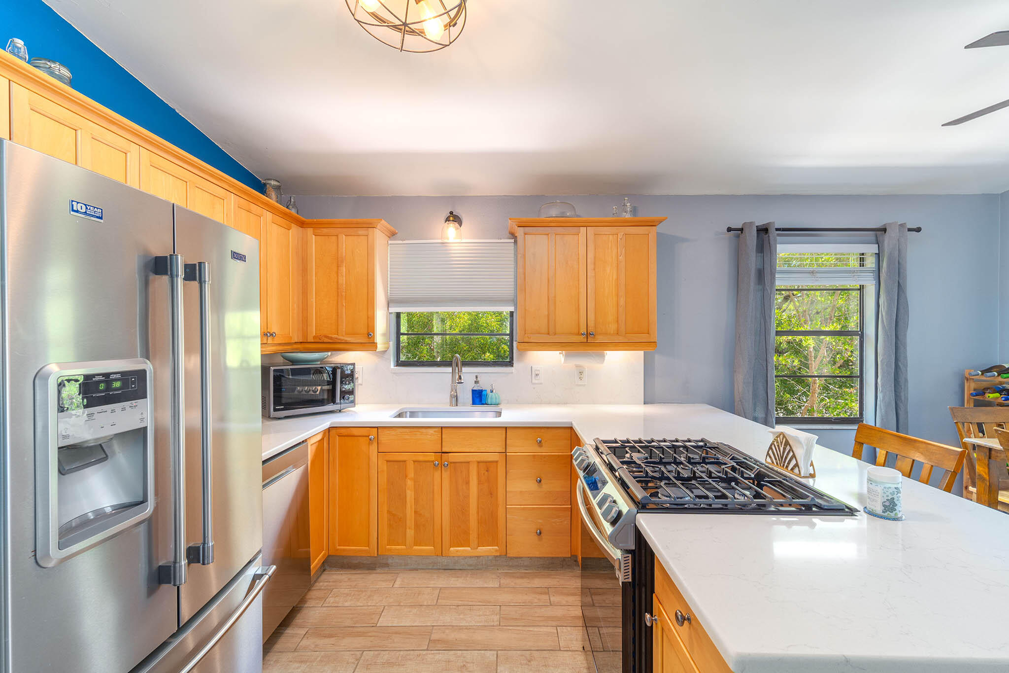 29951 Pine Channel Road Big Pine Key, FL 33043 - Photo 27 of 61 a kitchen with a sink stove and refrigerator