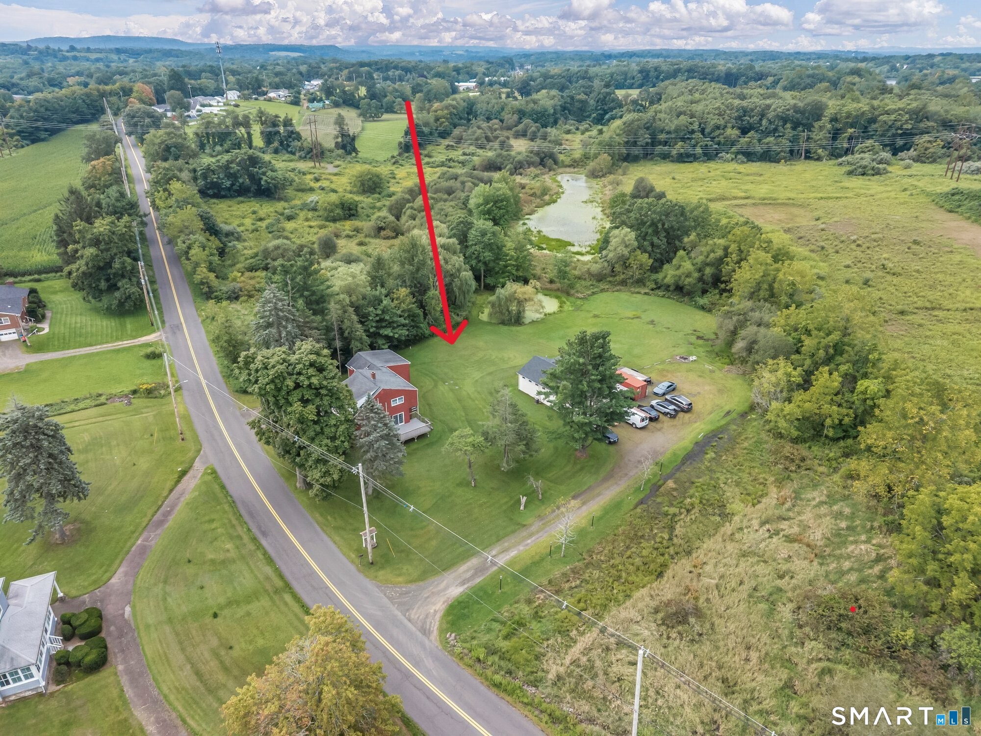 Arial view of property - 1.75 acres consisting of house, commercial building and pond